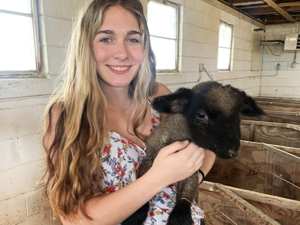 Emily with baby lamb